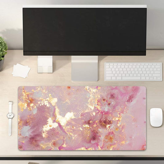 Desk setup with a large abstract design mouse pad, computer monitor, keyboard, and mouse.